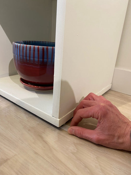 Art Gallery Owner Uses Wobble Wedges to Stabilize Display Shelves and Pottery