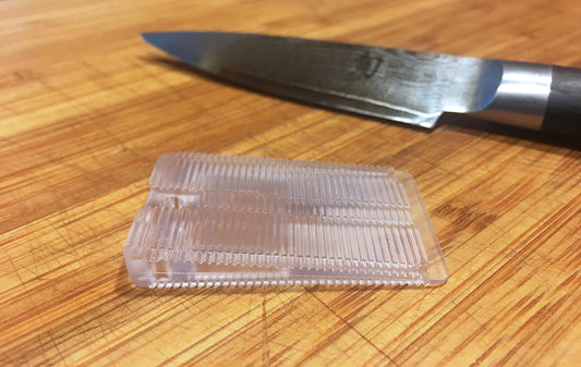 Stabilize a cutting board with wobble wedges