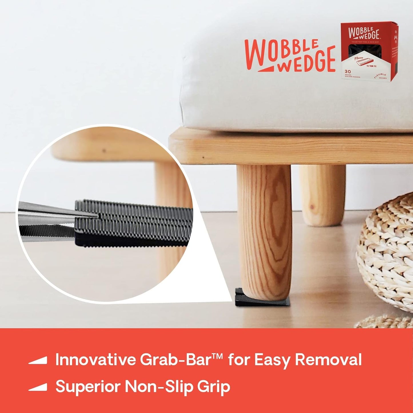 Black Wobble Wedge under wooden stool showing easy removal with Grab-Bar™ feature 