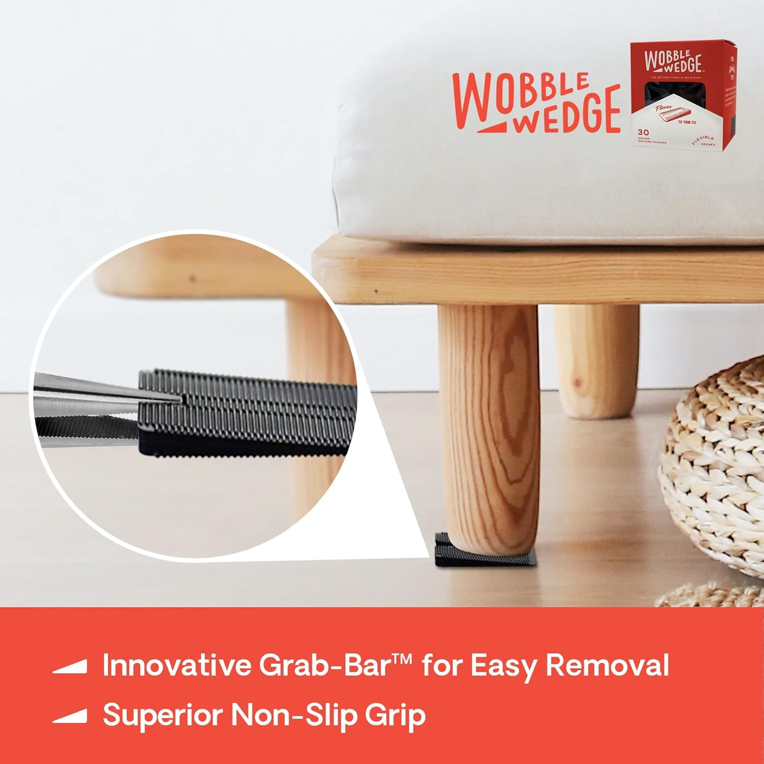 Black Wobble Wedge under wooden stool showing easy removal with Grab-Bar™ feature 
